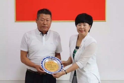 재칭다오왕청향우회, 홍수 피해 입은 고향에 성금 전해